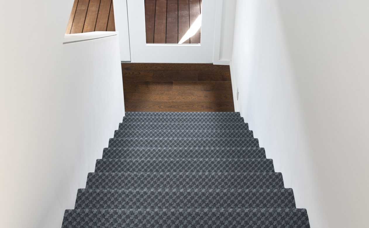 dark grey textured stair runner on staircase
